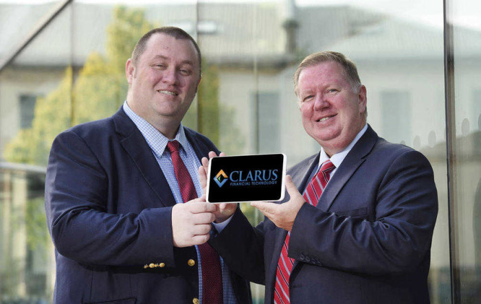 Gary Kennedy, left, and Bill Scott, Invest NI announce the fintech firm's expansion plans
